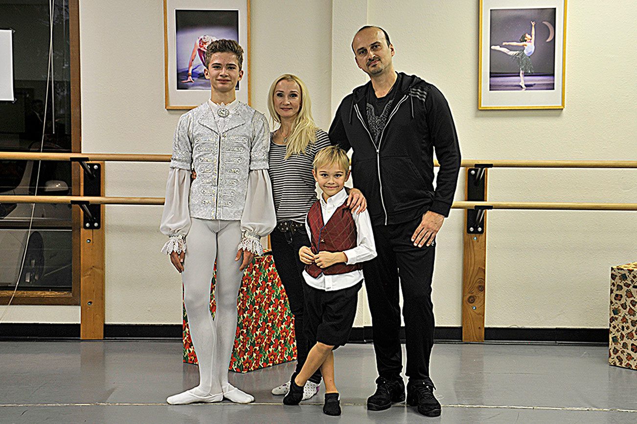 Teenage dancer pirouettes behind parents’s footsteps