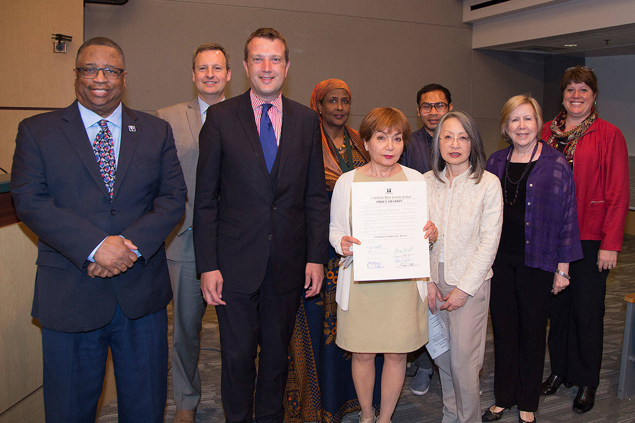 Representatives from the King County Immigrant and Refugee Task Force, the Refugee Women’s Alliance, Coalition of immigrants, Refugees and Communities of Color, the Chinese Information and Service Center join Councilmembers after the Council proclaimed June Immigrant Heritage Month in King County. (Courtesy Photo)