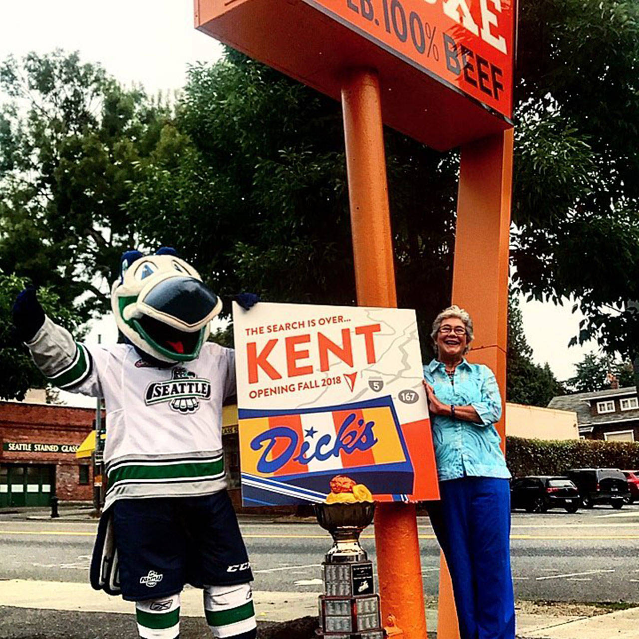 Mayor Suzette Cooke joins Cool Bird, the Seattle Thunderbirds’ mascot, in celebrating the announcement that Dick’s Drive-In is coming to Kent’s West Hill on Highway 99. COURTESY PHOTO, Dick’s Drive-In