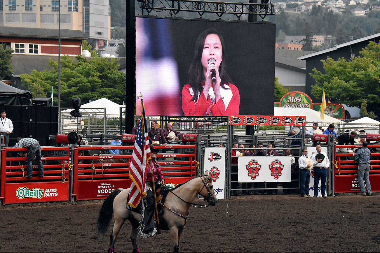 Hazen High School freshman Lena Hou performs the National Anthem Sept. 7 at the Washington State Fair Rodeo Playoffs. (Courtesy photo)