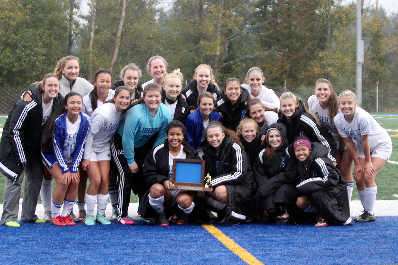 Liberty girls soccer team celebrates its 3-0 win over Cedarcrest Saturday to win the District 1/2 2A girls soccer tournament at Shoreline Stadium. The Patriots enter the state tournament as the No. 1 seed. (Sarah Brenden | Renton Reporter)