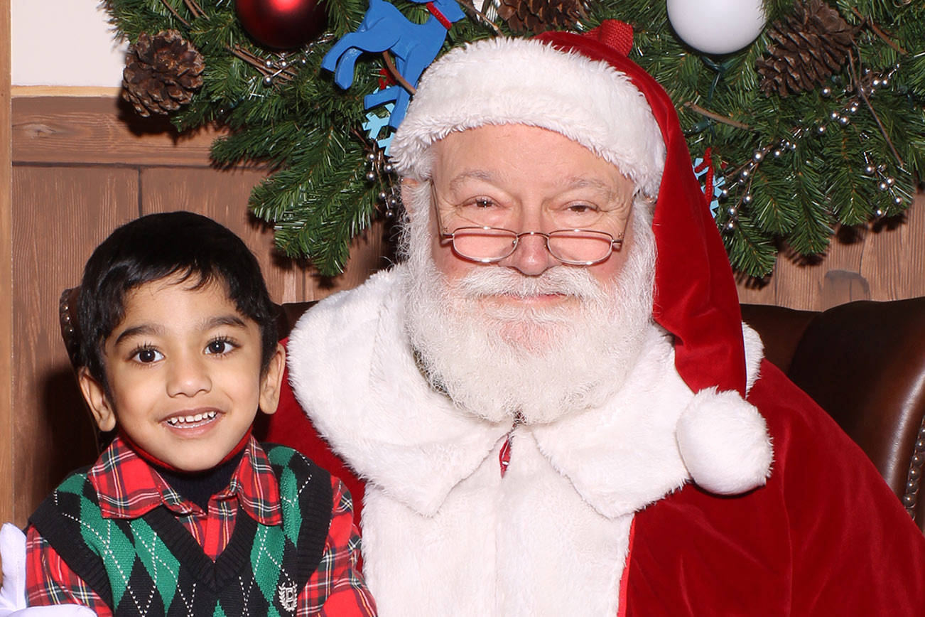 First Santa photography business continues to capture his magic within the community