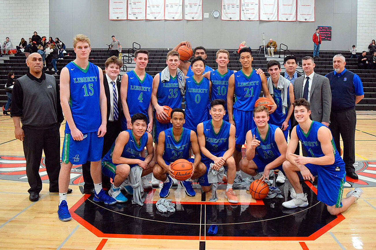 Liberty boys basketball team poses for a picture, right after their 64-35 win over Sammamish Tuesday. (Courtesy photo)