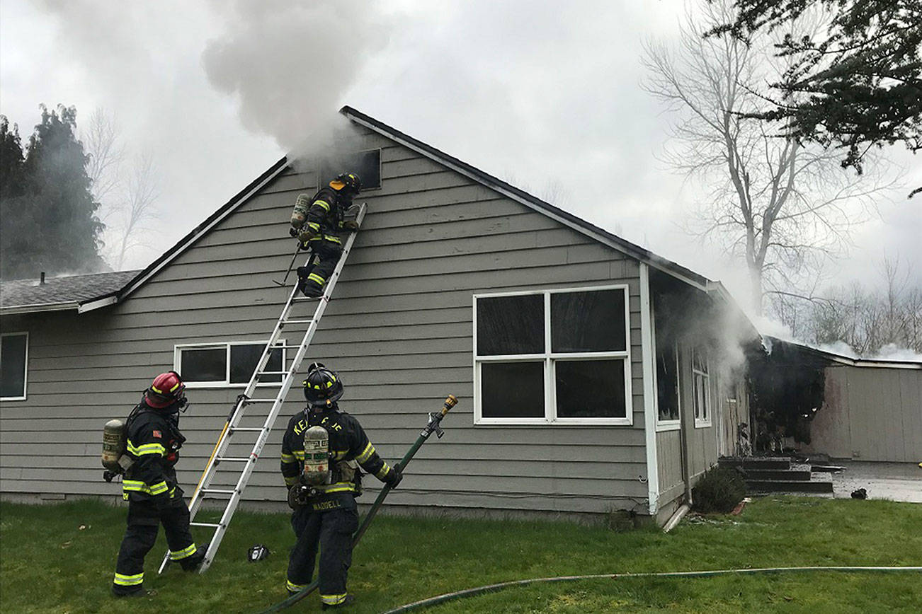 Renton Regional Fire Authority and Puget Sound Regional Fire Authority battled a Kent house fire on March 5. Two people were displaced. (Courtesy photos)
