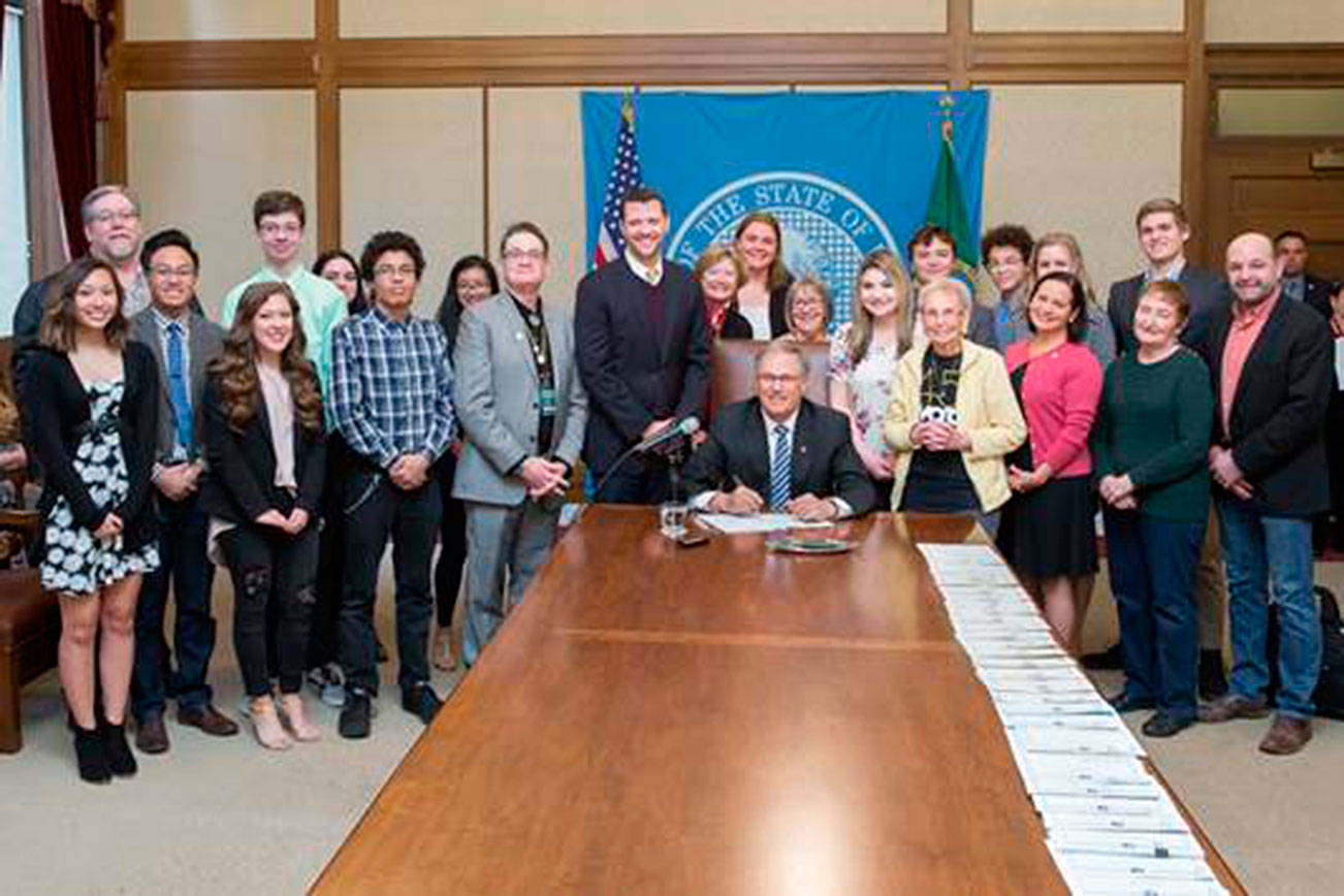 Student journalists, teachers, school administrators and advocates gathered in Olympia as the governor signed a law sponsored by Sen. Joe Fain extending free speech protections to students publishing in high school and college newspapers. COURTESY PHOTO