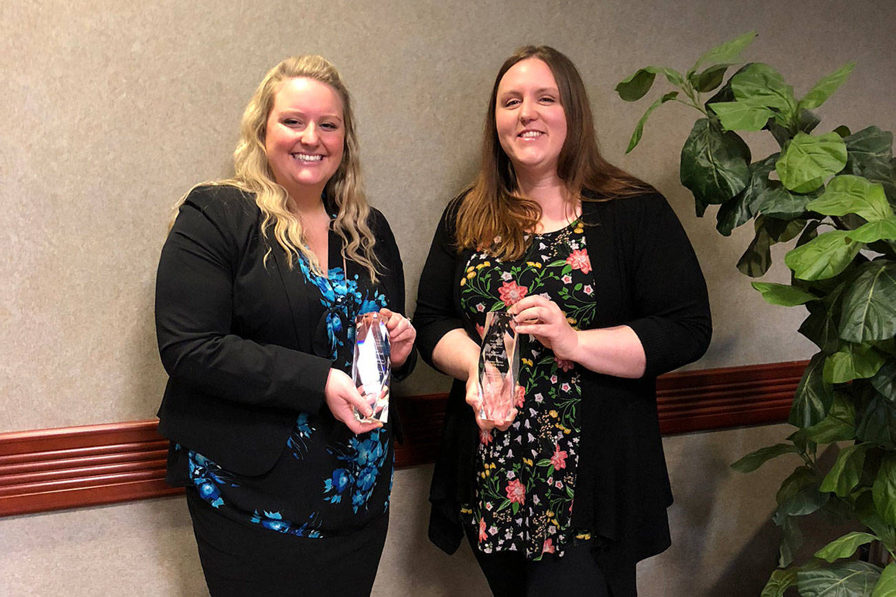 Holly Morgan, right, received the award for sustained performance and Christine Coxa, left, received an award for exemplary handling of a critical incident at King County Emergency Medical Services award ceremony March 9. Courtesy photo