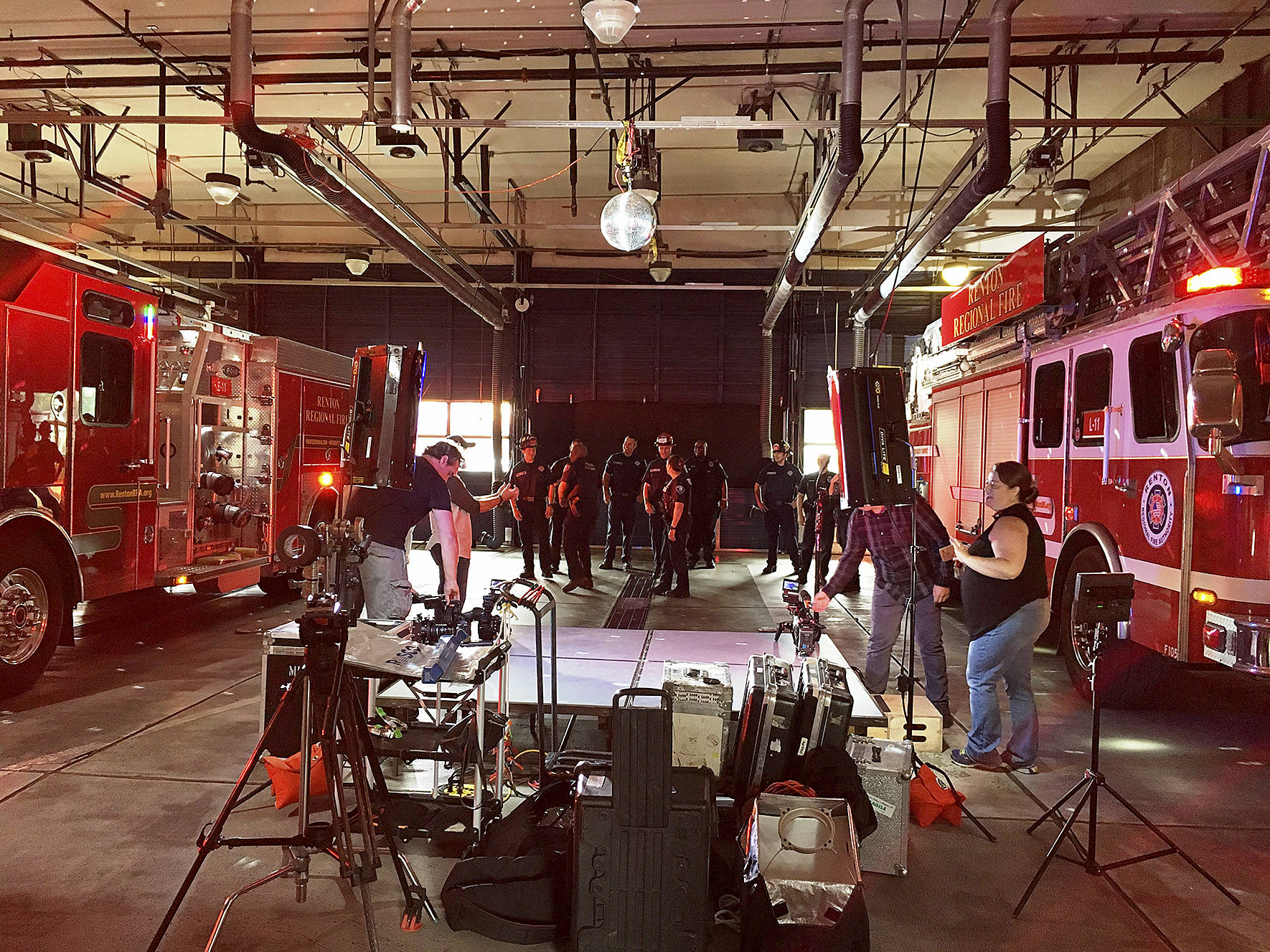 Photo courtesy of Renton Police Department                                Officers and Firefighters learning the dance moves for the video.