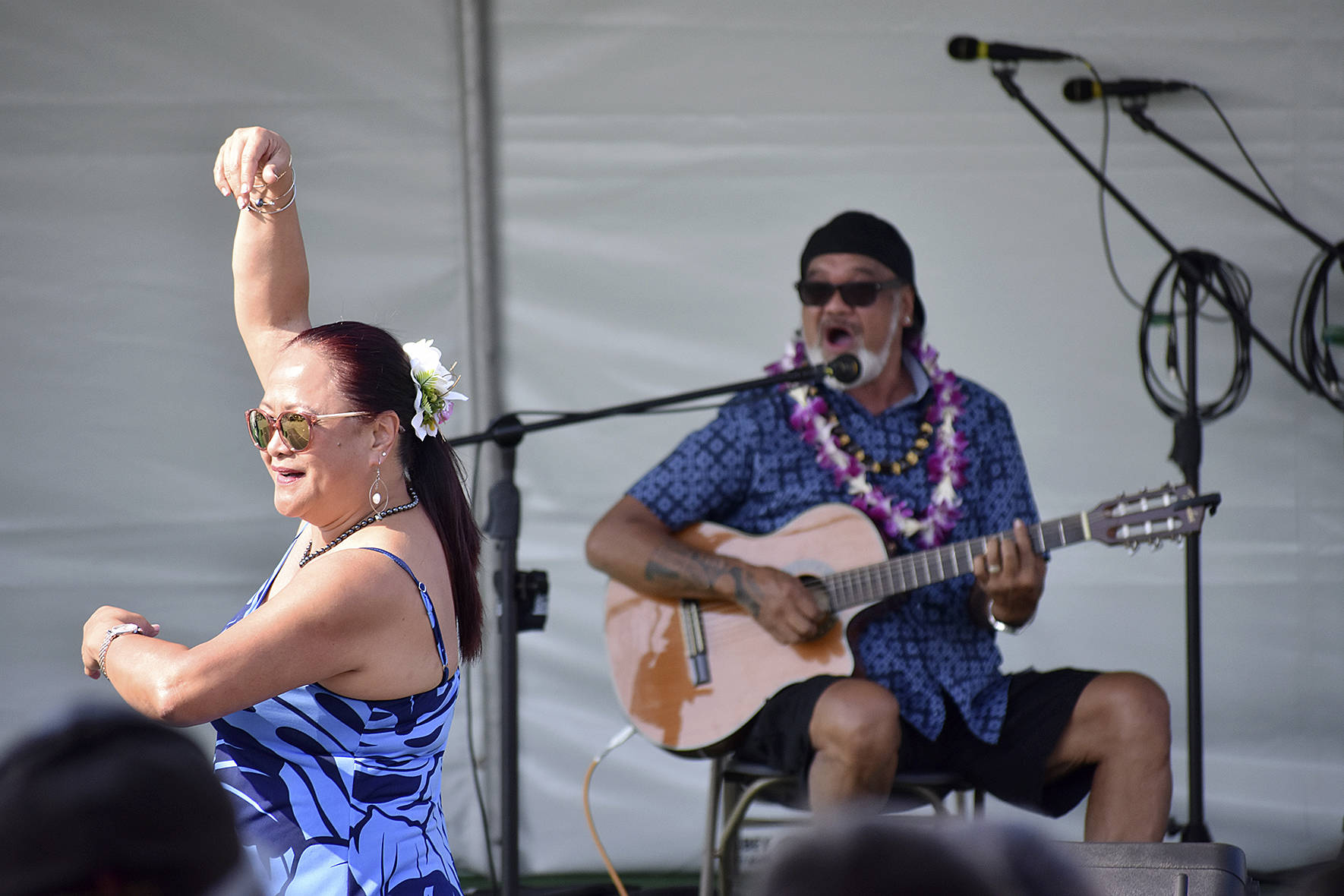Headliner for Polynesian Festival Bruddah Waltah, who traveled from Hawaii to perform, plays while his wife of 43 years, Thailiana, dances on Saturday Aug. 18.