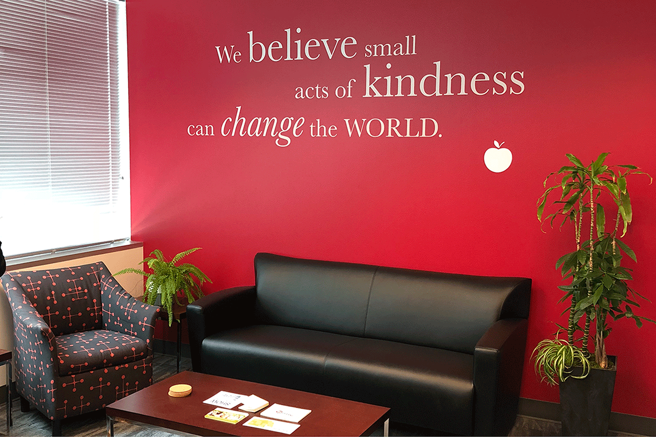 InvestEd’s new waiting room with a quote about small acts of kindness— what the organization was founded on. Photo courtesy of Joyce Walters.