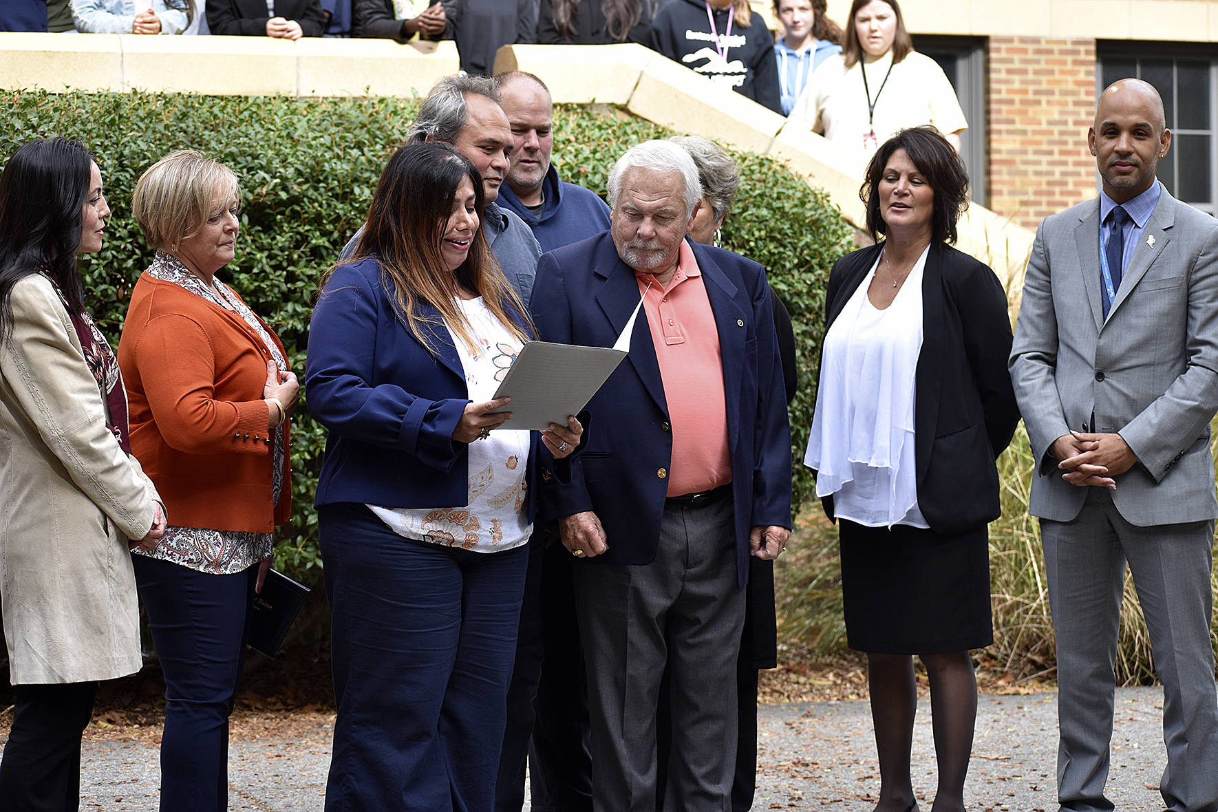 Renton High School principal Giovanna San Martin speaks before Mead receives his diploma.