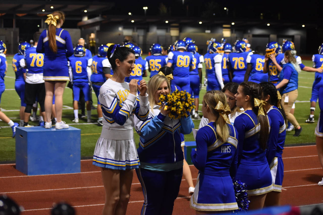 Photo courtesy Isabella Fredrickson.                                Former Hazen cheerleaders joined current ones Sept. 28 during Hazen’s 50th anniversary celebration at the school’s homecoming game.
