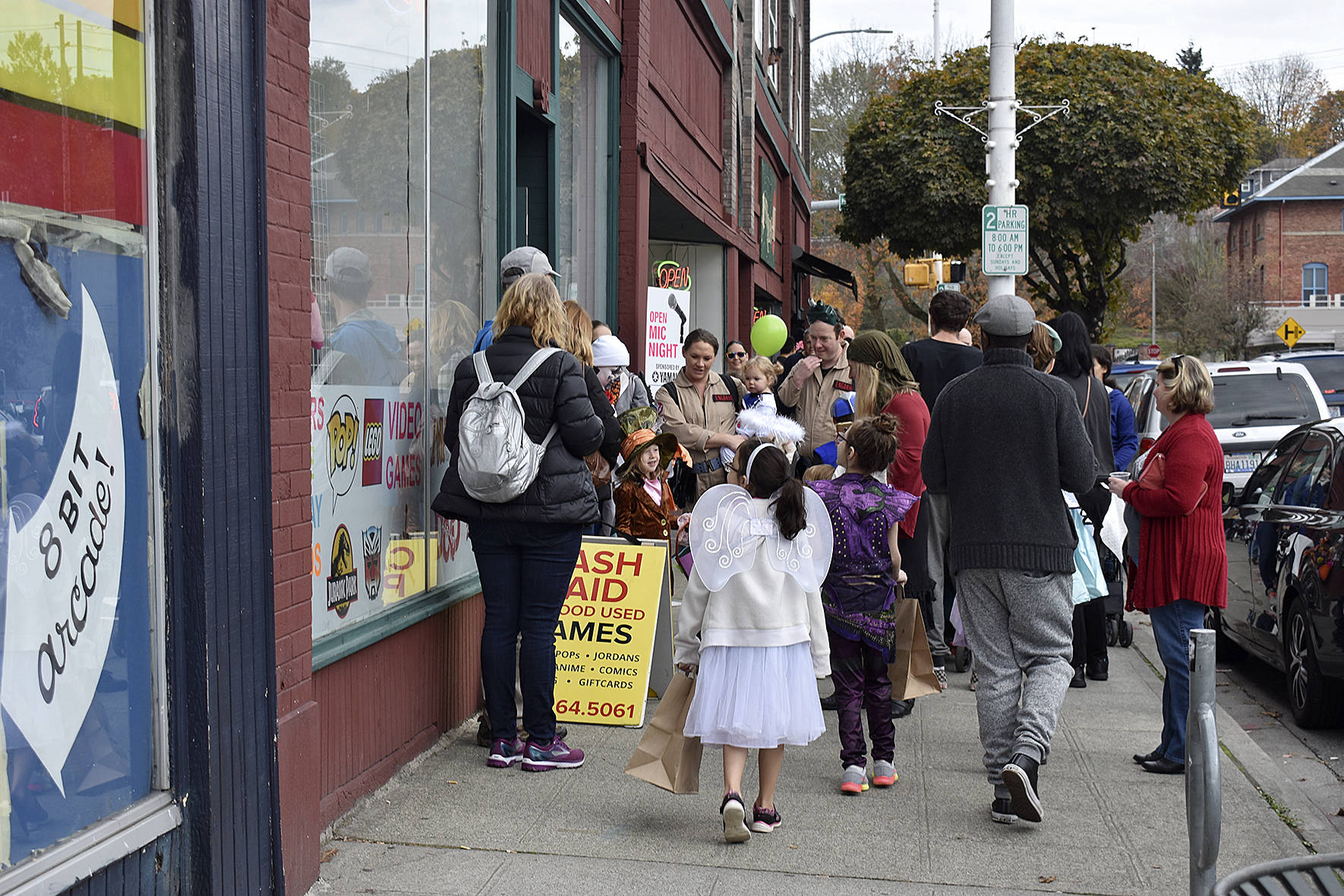 Crowds gathered throughout downtown to ask for candy from different local businesses.