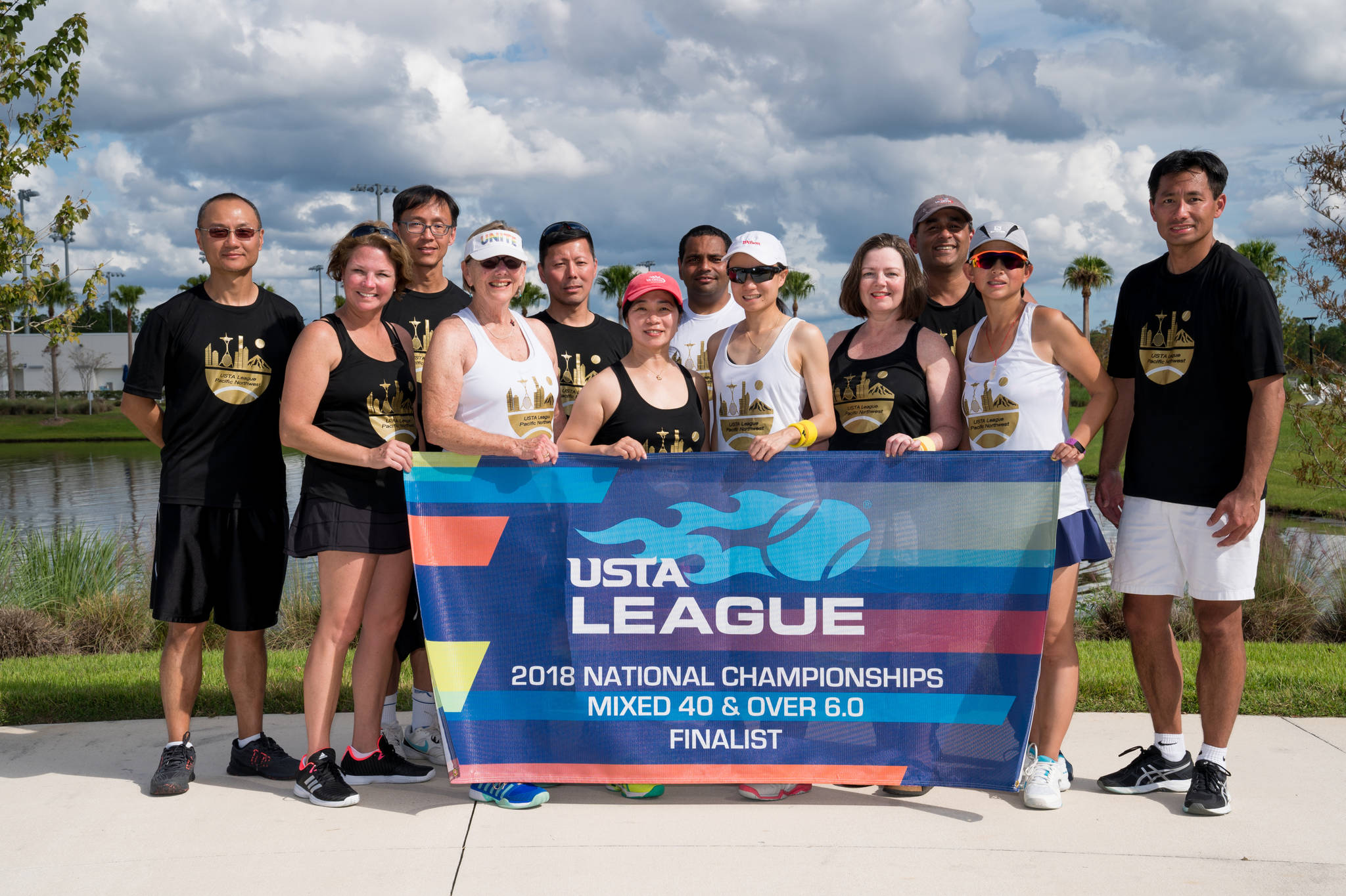Front, left to right: Michele Lalime, Pat Tuton, Kitty Hubbard, Zhe Li, Shawn Thornsberry, Tracy Qi and Calvin Vu; back, left to right: Zheng Mu, Shu Shen, Daniel Chua, Rajesh Singh and Jeetu Thakur. The team designed its own gold logo, complete with the Space Needle, Mount Rainier, the Columbia Center and Smith Tower. Courtesy photo