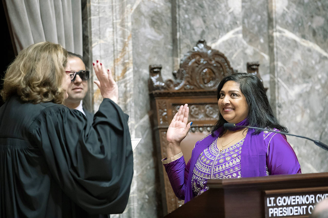 COURTESY PHOTO, Washington State Senate                                Sen. Mona Das, D-Covington, right, is sworn into the Washington State Senate by State Supreme Court Chief Justice Mary Fairhurst on Monday.