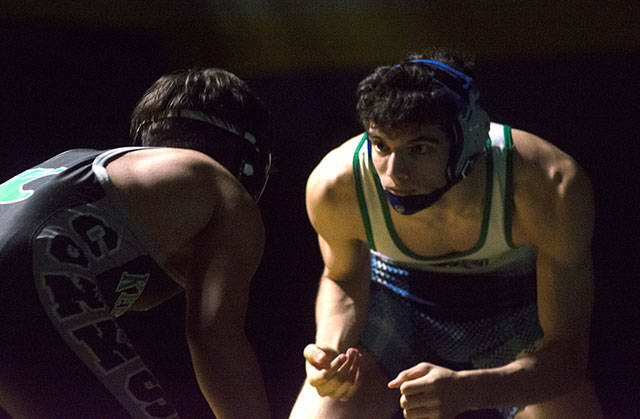 Anthony Guererro from Hazen and Kentwood’s JR Rouse face off in a 160 pound exhibition. Photo by Kayse Angel