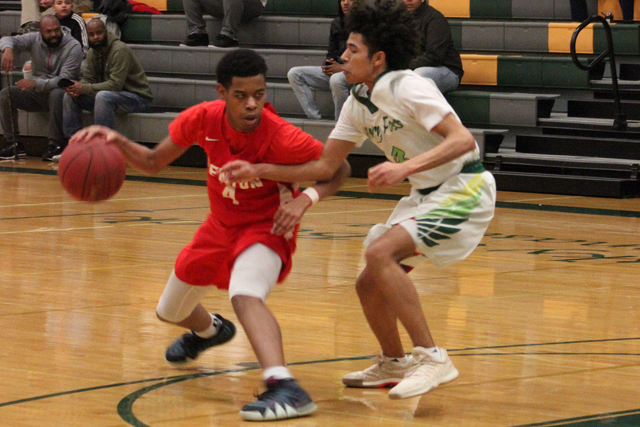 Senior guard Isaiah Little drives past his defender in the first half of Thursday’s win over Foss. Photo by Sarah Brenden