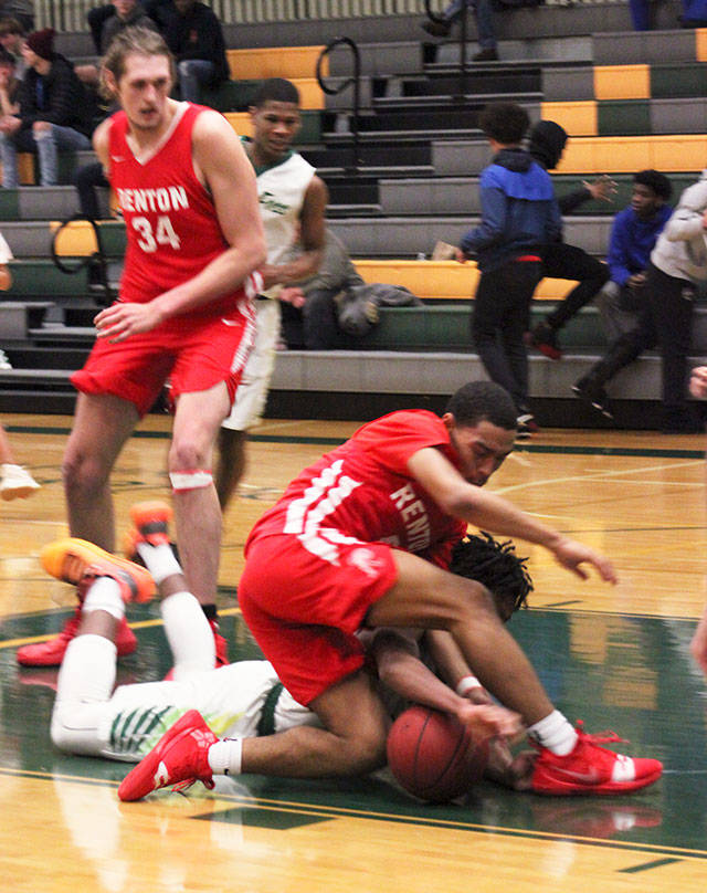 Junior guard O’Shae Barquet fights for possession. Photo by Kayse Angel