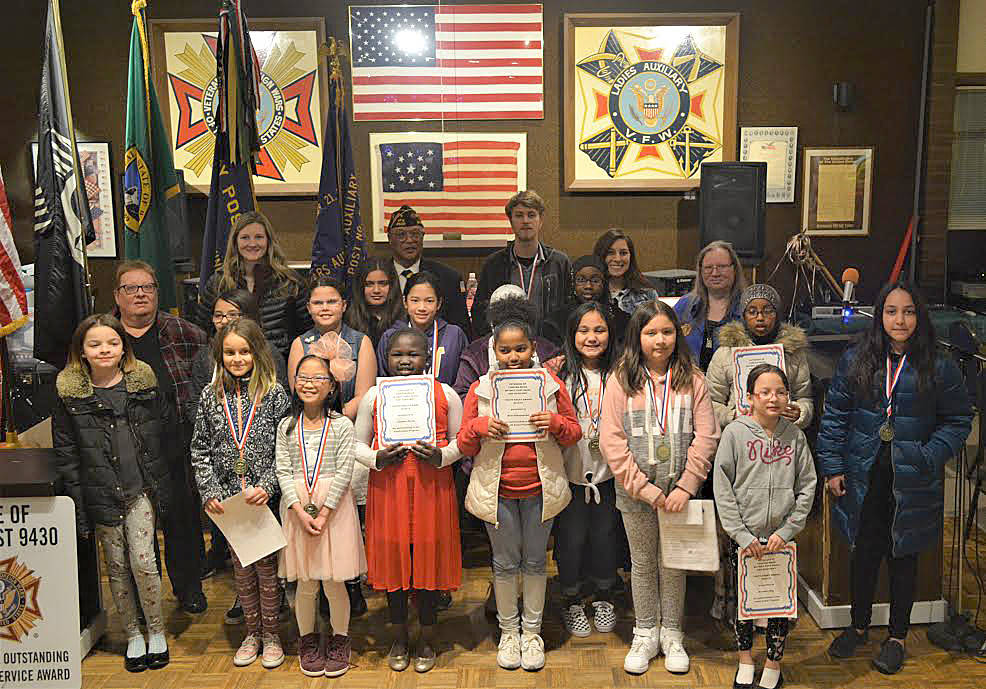 Youth essay winners and their teachers pose during the award ceremony at the Veterans of Foreign Wars Post No. 9430 in Skyway. Courtesy photo