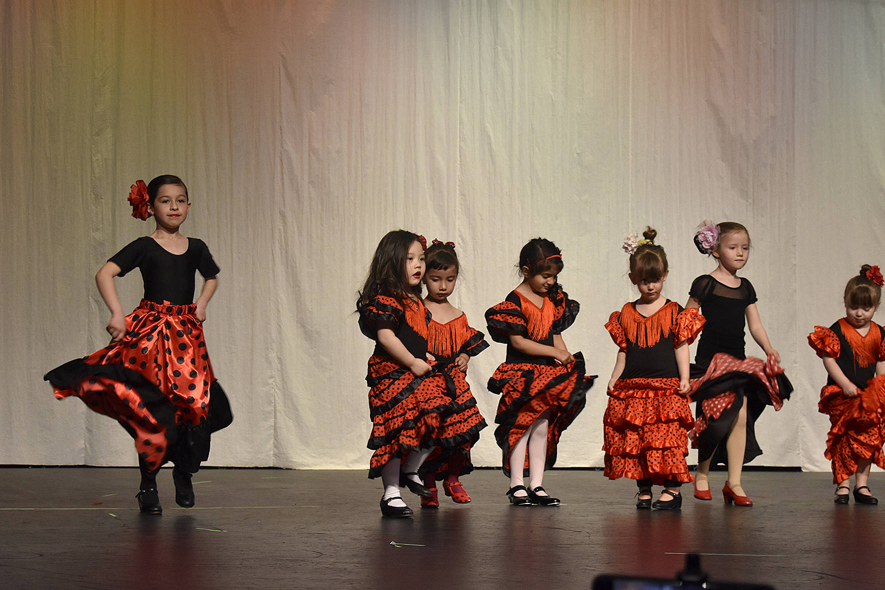 Photos by Haley Ausbun                                Semilla Flamenca in Redmond had their spring recital Friday, April 26 at the Carco Theatre in Renton. Nearly 60 flamenco dancers, from 2 year olds to adults, were able to show off their skills in ten performances, concluding with a group dance of the Macarena. All proceeds for the recital went to a 6-year-old dancer who has been fighting leukemia for three years and is now in remission with monthly check-ups, flamenco teacher Paulina Chalita-White said.