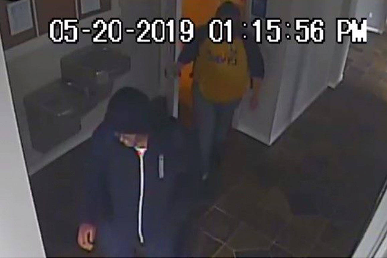 Photo courtesy of Renton Police Department. Footage of two persons suspected in a suspicious fire from May 20.