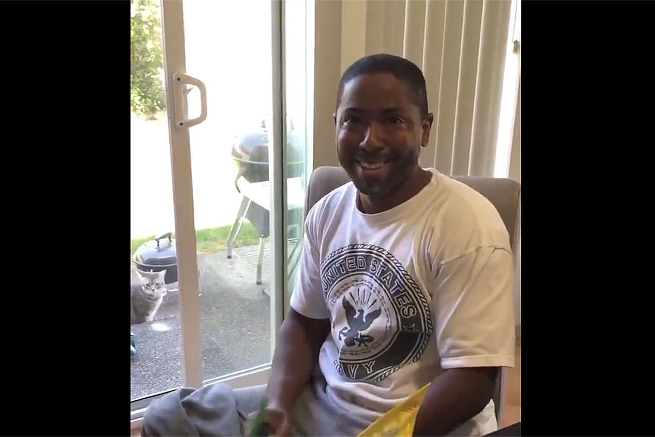 Photos from the viral video of two Renton women surprising their stepfather with changing their last names to his on Father’s Day, Sunday June 16.