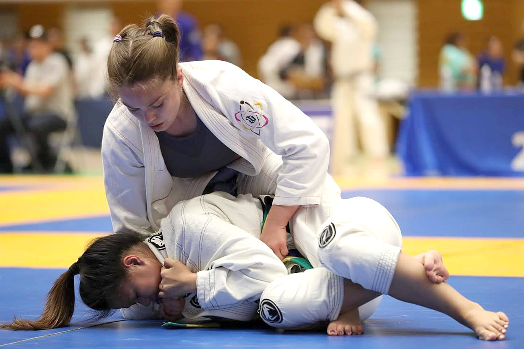 Photos submitted by Renton Martial Arts Center                                Anaya, 32, Renton, pins her opponent during the International Brazilian Jiu Jitsu Federation’s Tokyo Open on June 15.
