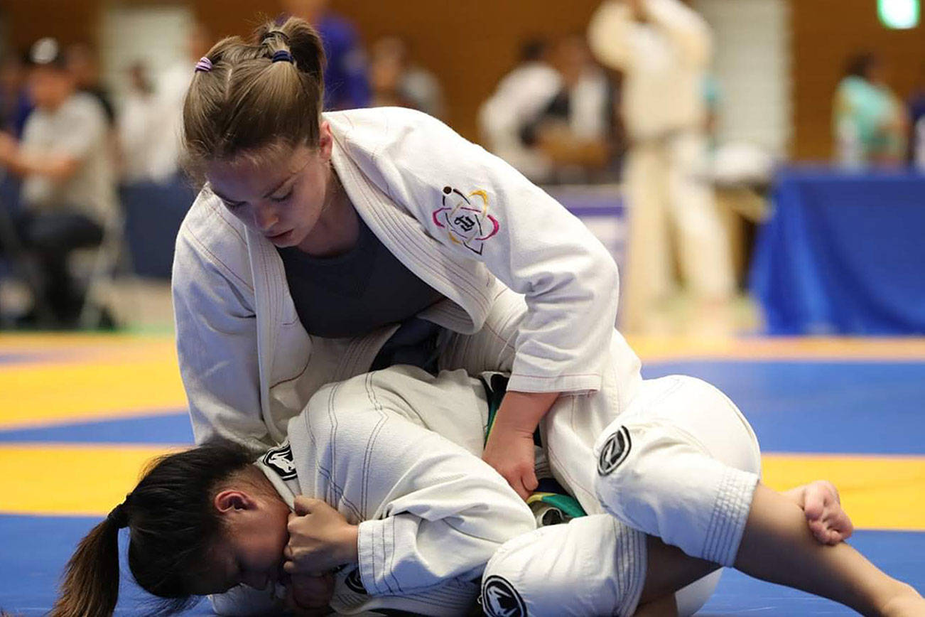 Courtney Anaya, 32, Renton, pins her opponent during the International Brazilian Jiu Jitsu Federation’s Tokyo Open on June 15. Photos submitted by Renton Martial Arts Center