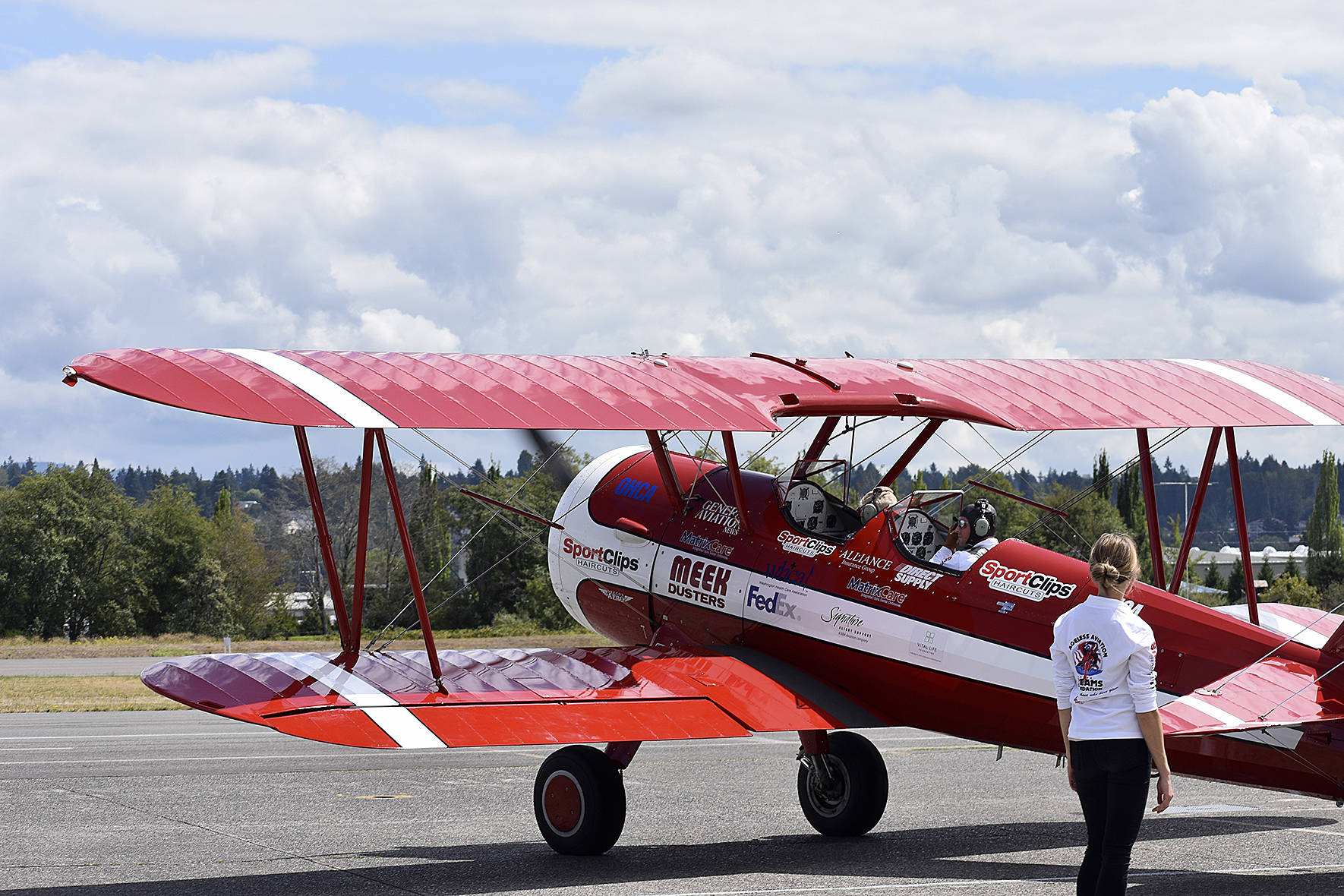 Photo by Haley Ausbun. Seniors in nearby care facilities took flight in a 1942 Boeing Stearman biplane at Renton Municipal Airport, offered by Ageless Aviation Dreams Foundation.