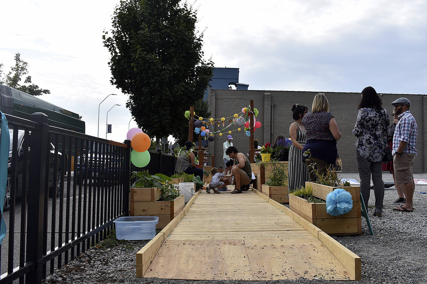 A new, temporary “Pop-up Park” gave Renton residents visiting the local farmers market a place to rest, or play, for a short-time.                                Photo by Haley Ausbun.