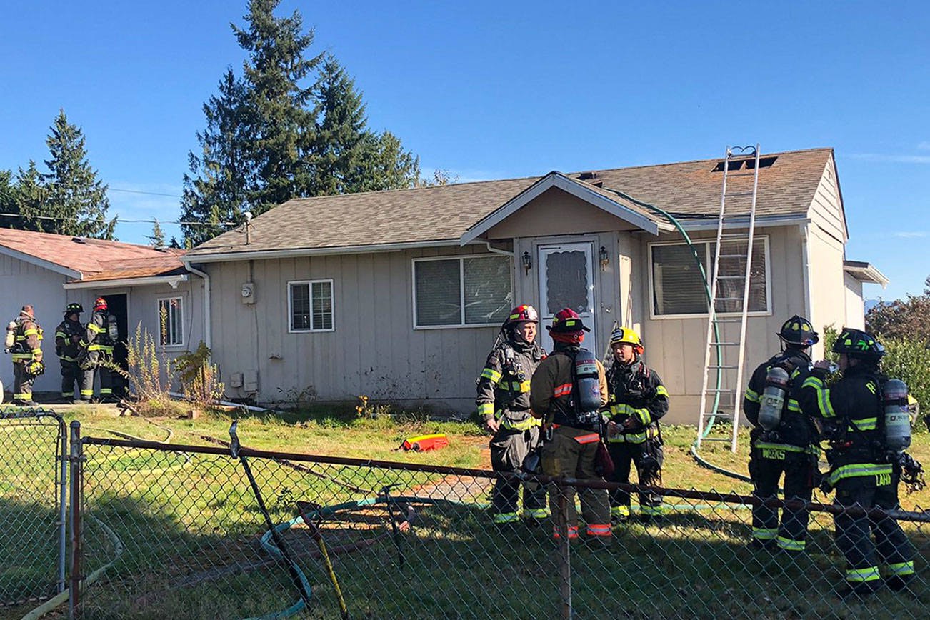 Photo courtesy of Skyway Fire (King County Fire District 20). Firefighters after putting out a fire in Skyway.
