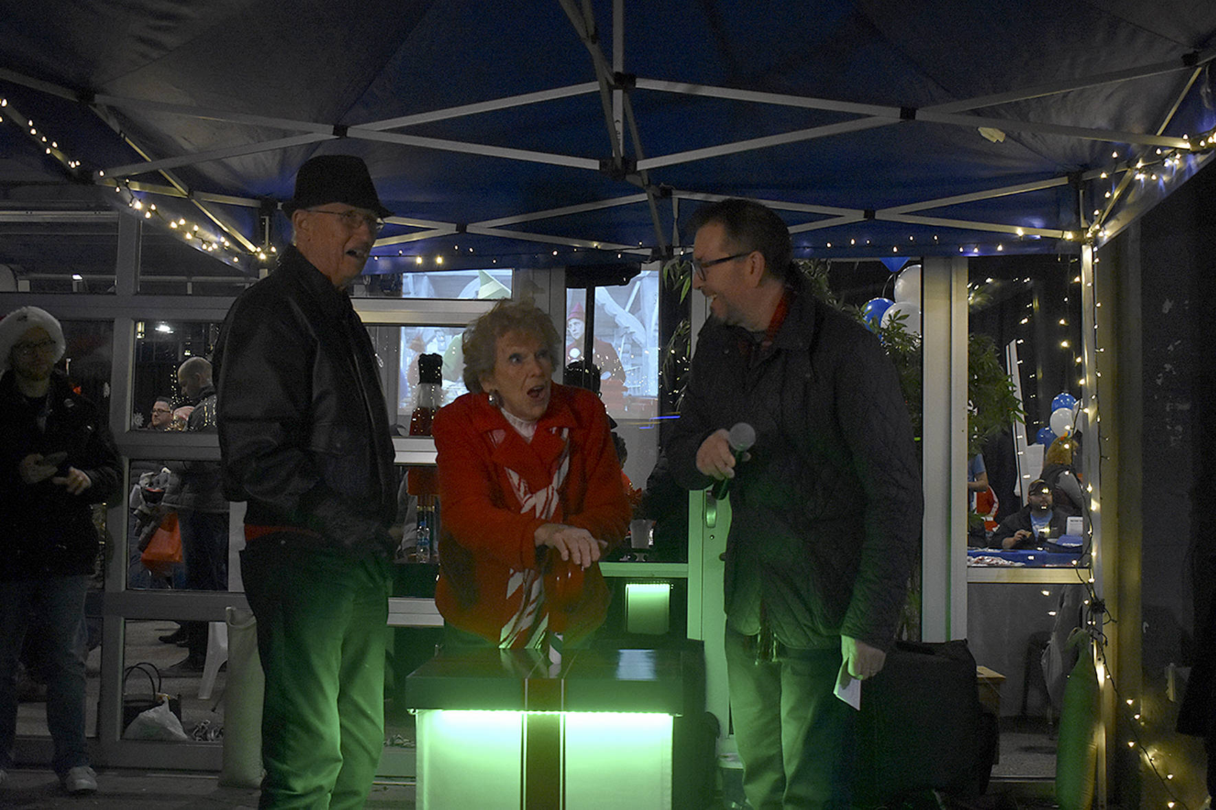 Photo by Haley Ausbun. Left to right: Bill Moss, Fay Moss, Renton residents and longtime contributors to the community, and Mayor-elect Armondo Pavone, pulled the switch to light to the downtown tree, Saturday, Nov. 30 at Piazza Park.