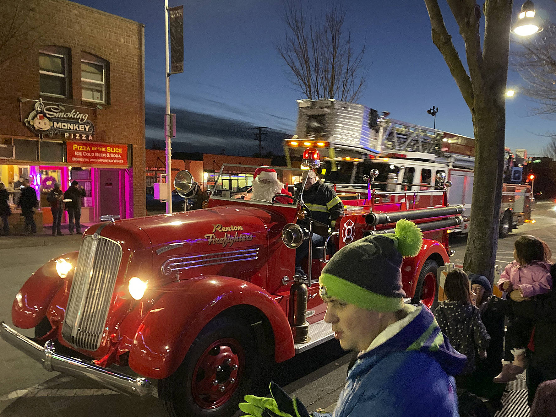 Photo by Haley Ausbun. After the tree lighting, Santa Claus rolled up with his friends at Renton Regional Fire Authority, Saturday, Nov. 30 at Piazza Park.