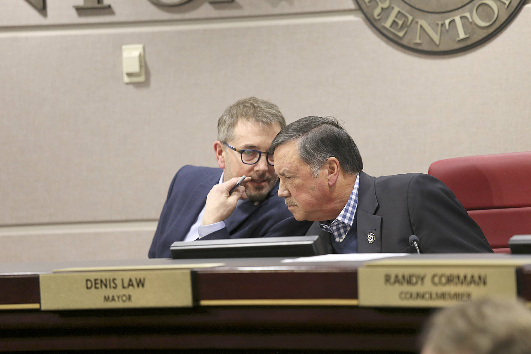Photo courtesy of city of Renton. Future Mayor Armondo Pavone talks to Mayor Denis Law during his final council meeting, Monday, Dec. 9, 2019.
