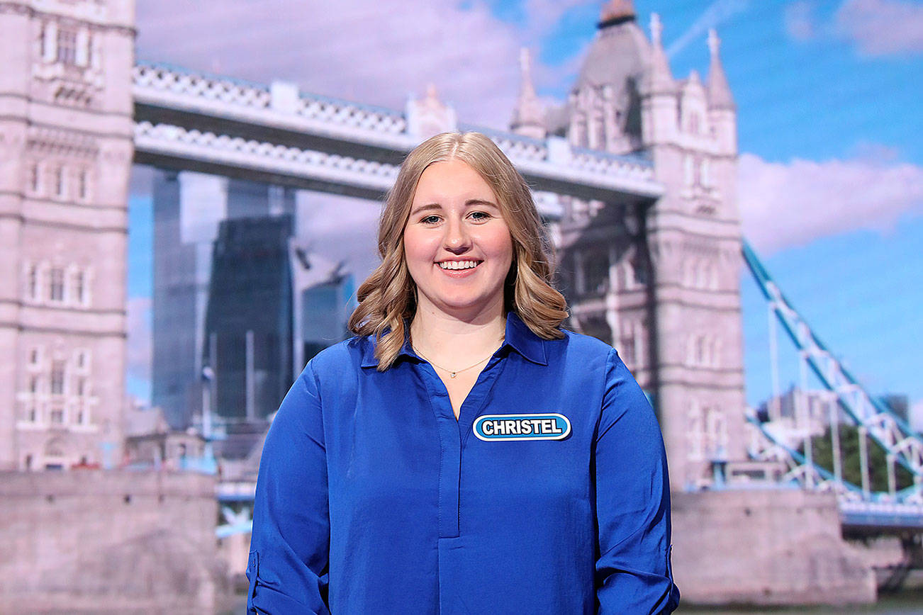 Photo courtesy of Carol Kaelson. Christel Tucker, a Renton resident and flight attendant, stands at the wheel at Wheel of Fortune. Her episode airs Monday, Jan. 20.