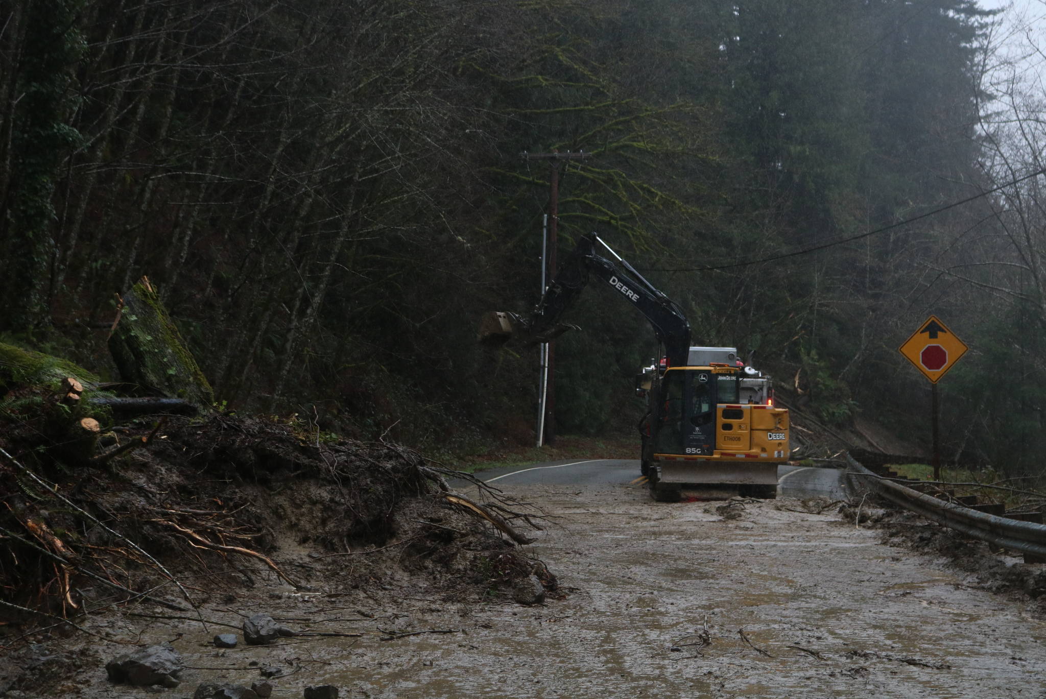 A King County work crew clears a road near Preston on Feb. 7, 2020. Heavy rains appear to have caused multiple landslides along the road. Aaron Kunkler/staff photo