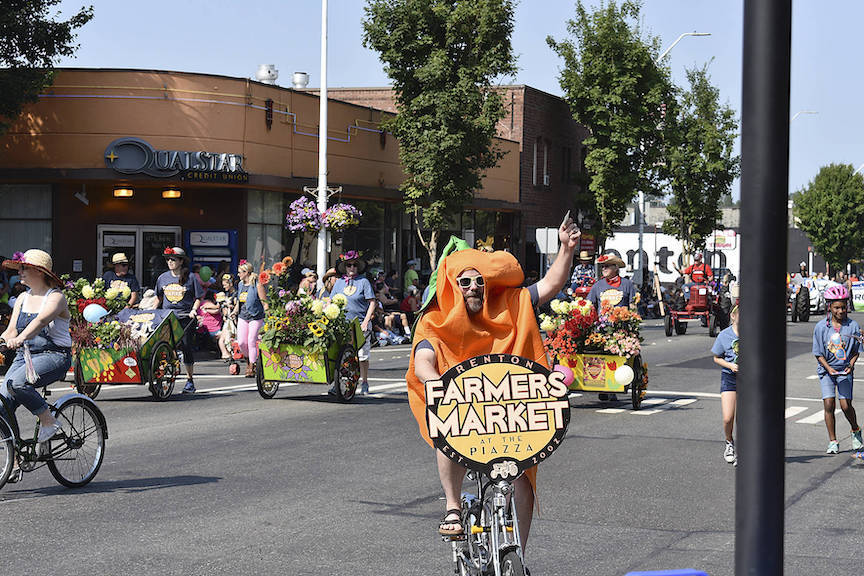 A man in a carrot suit waves to the crowd during the Renton River Days parade in 2018. File photo
