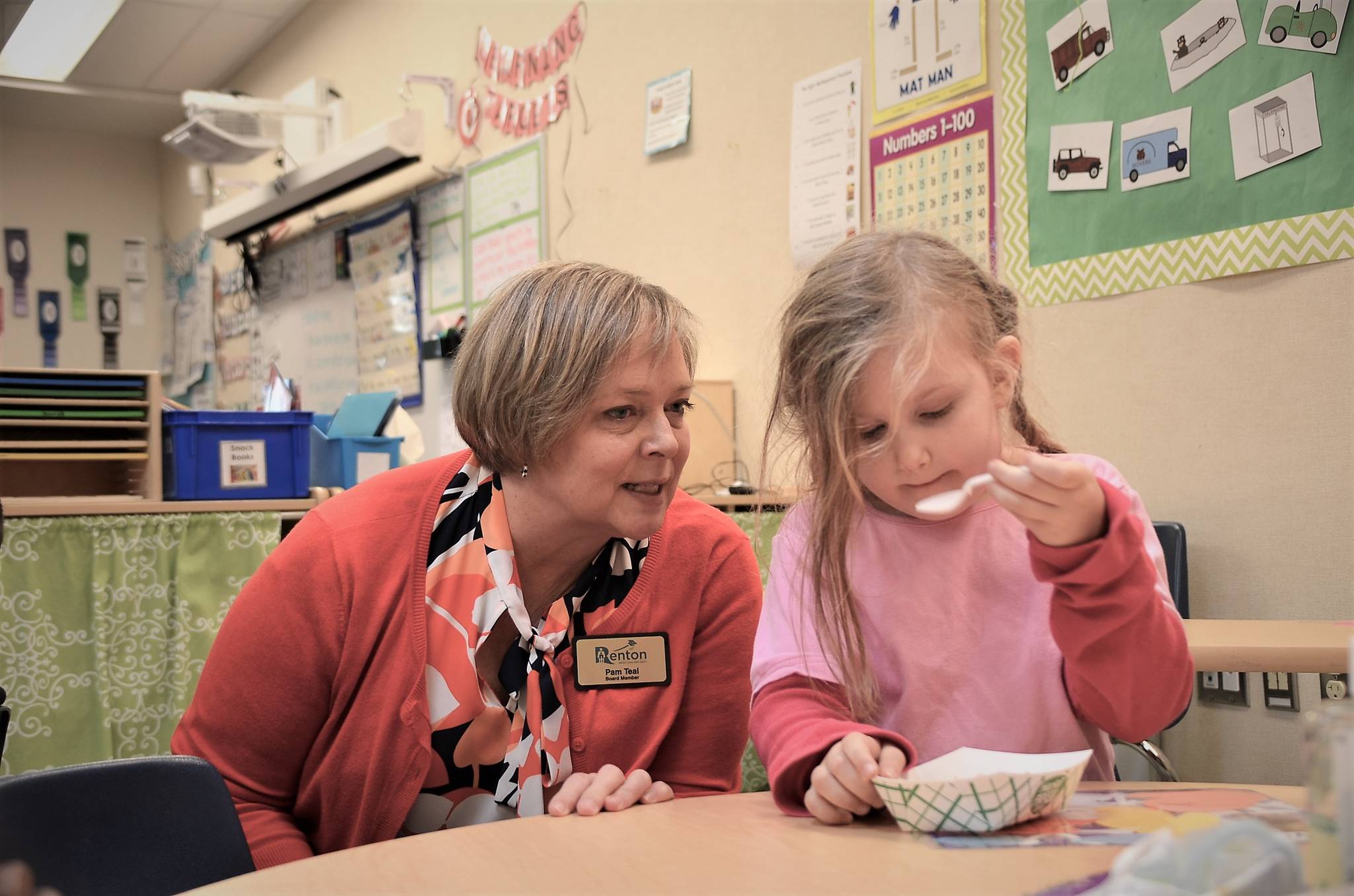 Long time board member Pam Teal with a child at Meadow Crest Early Learning Center, 2018. Courtesy photo.