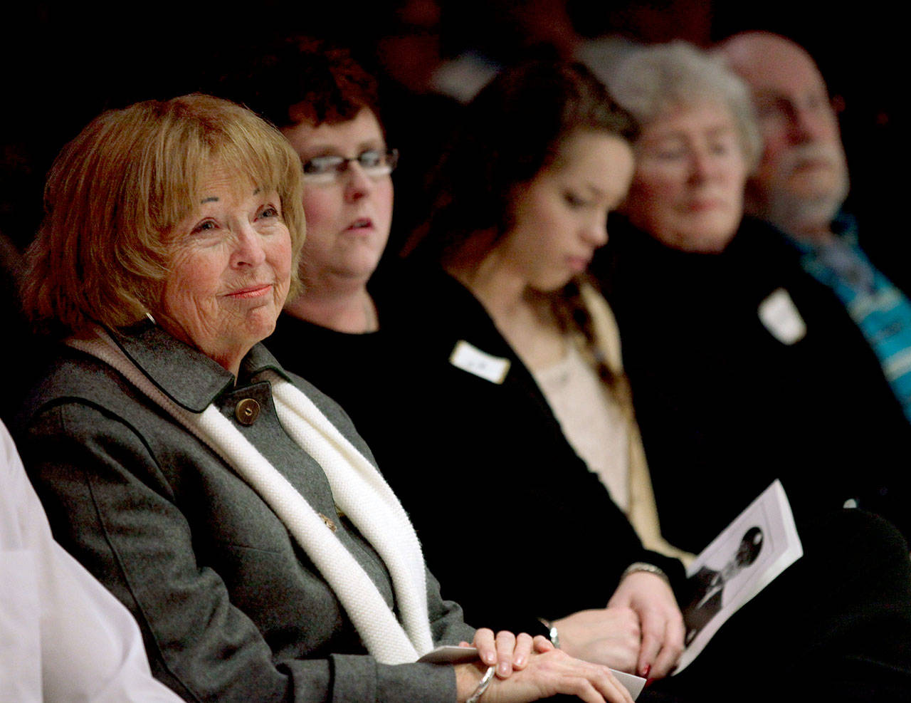 Kathy Parks and family members listen to speakers during the Gary Parks Remembrance ceremony at Everett Community College in 2012. From left: Kathy Parks, daughter Jennifer Parks, granddaughter Marissa Van Ry, Carol and bother John Parks. (Michael O’Leary / Herald file)