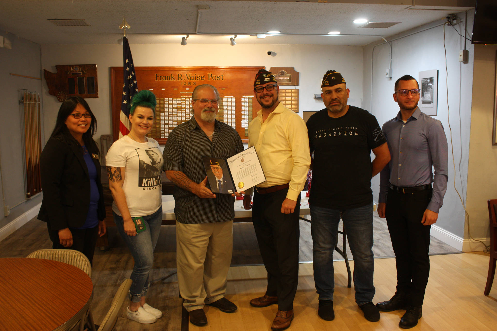 (left to right) Renton City Councilmember, Kim-Khanh Van, Manager at Buddy’s Cannabis, Nicole Meador, Owner of Buddy’s Cannabis, Myles Harlow Kahn, Former Post Commander, Joshua Schreck, Post Commander, Martin Tamayo, pose as Buddy’s Cannabis owner receive VFW award. (photo credit: Cameron Sheppard)