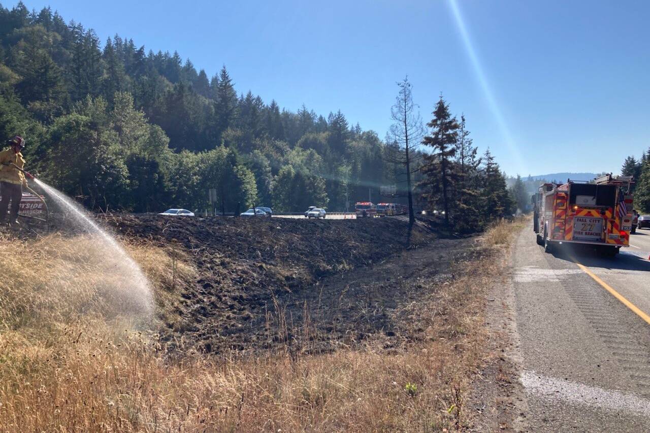 Eastside Fire and Rescue responds to a large brush fire July 25 on Interstate 90 near High Point Way east of Issaquah. Courtesy photo