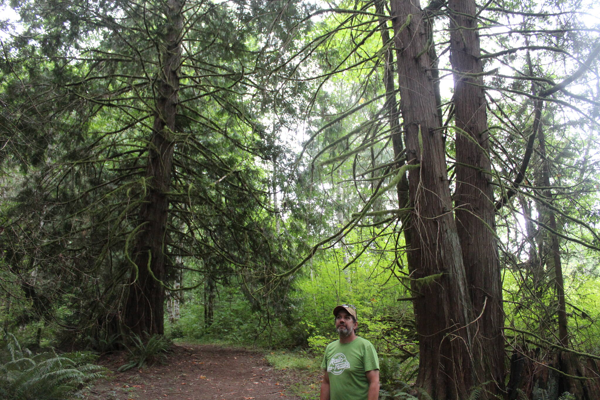 Jay Morris stands on the easement trail that runs through his property. Photo by Bailey Jo Josie/Sound Publishing.