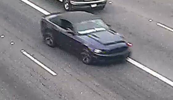 The suspect is still at large, last seen driving this dark blue Ford Mustang convertible with white writing on the lower portion of the windshield. Photo courtesy of Washington State Patrol.