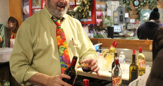 Photo by Bailey Jo Josie/Sound Publishing
A bottle from Naches Heights winery is poured at Cugini Florist on 3rd Street.