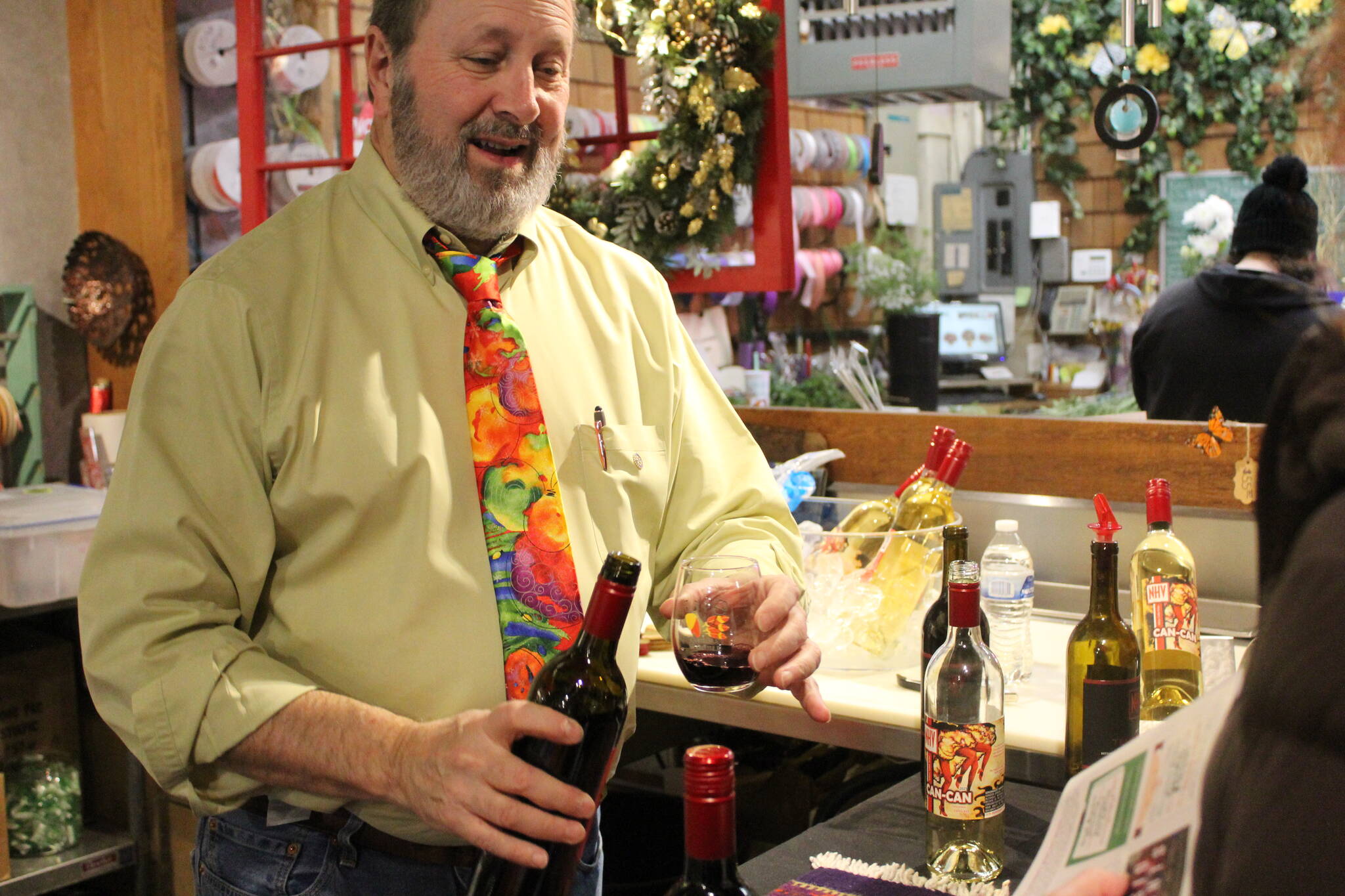 Photo by Bailey Jo Josie/Sound Publishing
A bottle from Naches Heights winery is poured at Cugini Florist on 3rd Street.