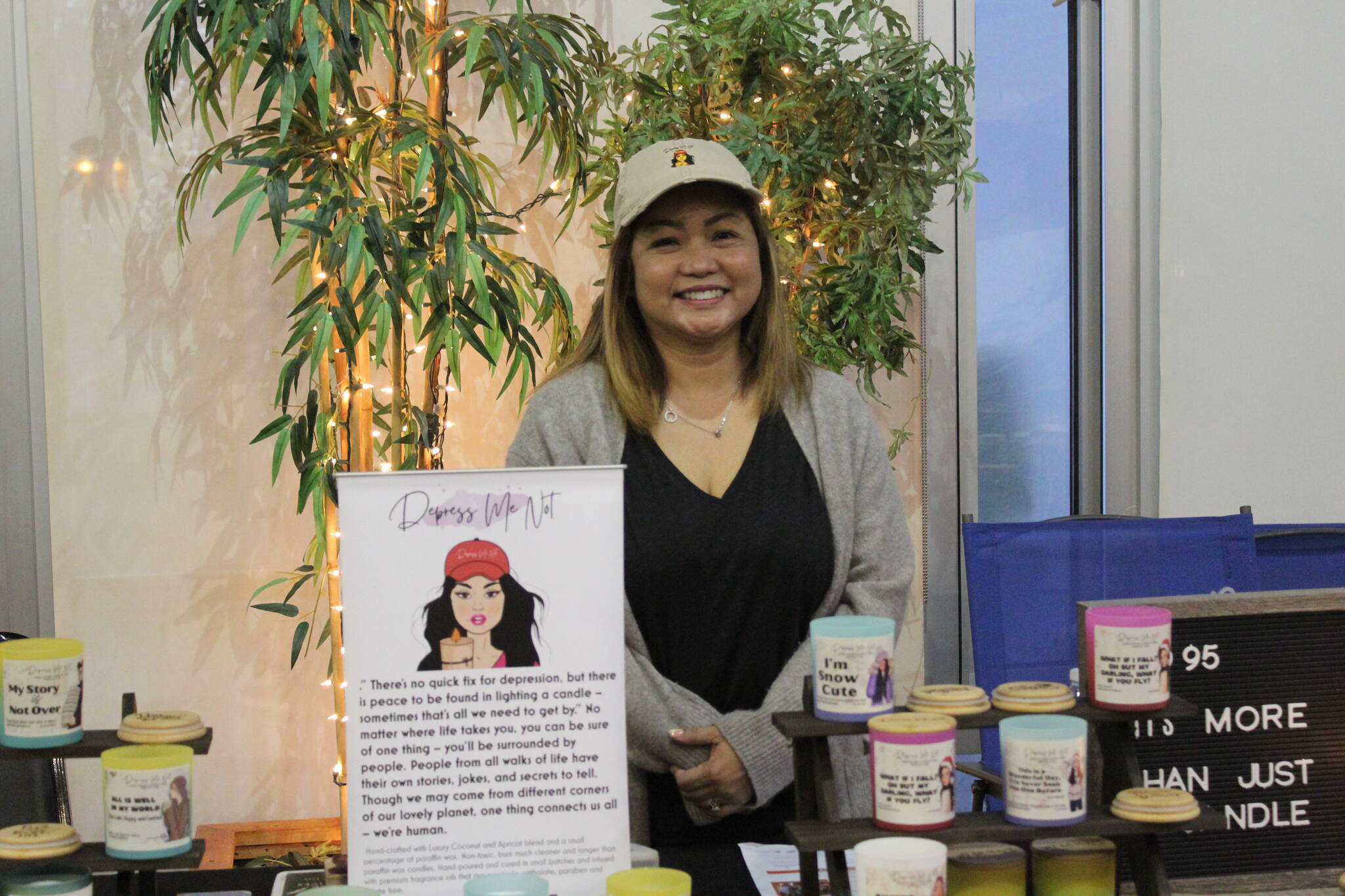 Divina of Depress Me Not Candles is all smiles during Renton's Small Business Saturday. Photo by Bailey Jo Josie/Sound Publishing.