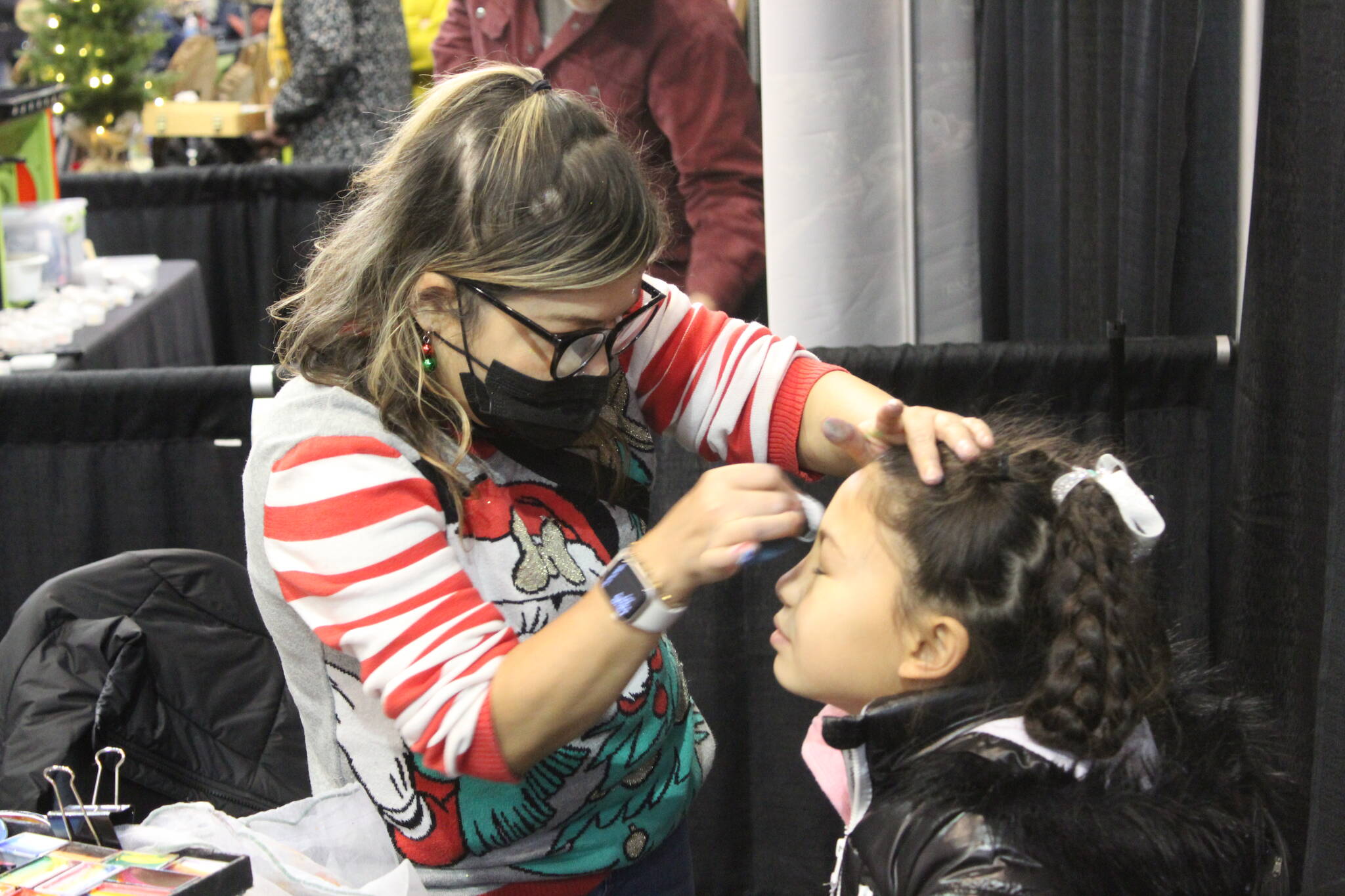Photo by Bailey Jo Josie/Sound Publishing.
Face painting was a popular booth for kids to visit as they waited for Santa.