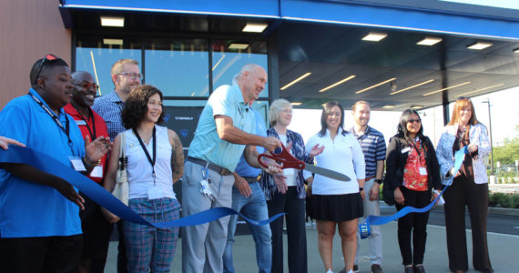 Renton Mayor Armondo Pavone and several members of the Renton City Council accompany Topgolf Renton Director of Operations Paul Howard for the ribbon-cutting ceremony. Bailey Jo Josie/Sound Publishing