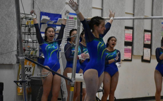 Hazen gymnasts supporting their teammate with cheers. Ben Ray/Renton Reporter