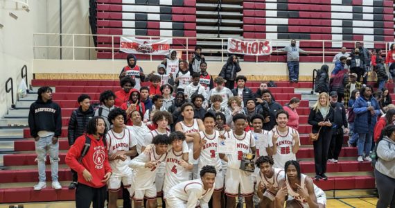 Renton boys pose with the student section after their KingCo championship victory. Ben Ray / The Reporter