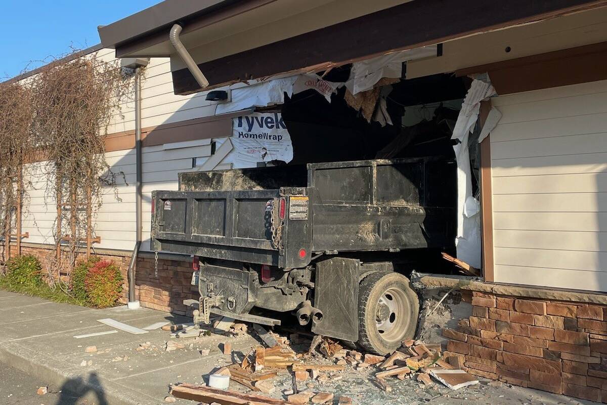 The truck was in the parking lot near the Maple Valley Eye Care Center before crashing into the building. Photo courtesy of Puget Sound Regional Fire Authority.